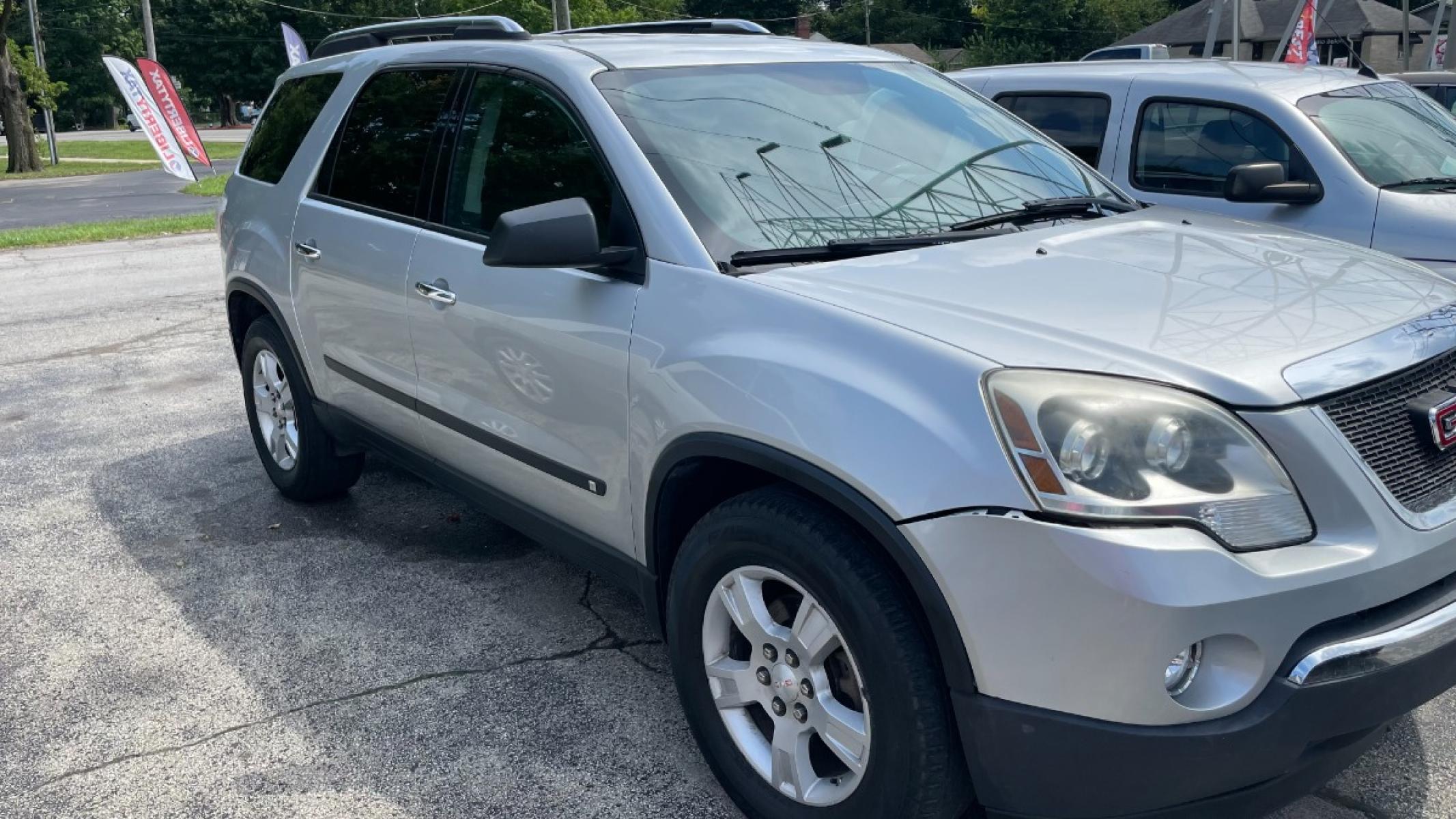 2009 Silver GMC Acadia SLE-1 AWD (1GKEV13D09J) with an 3.6L V6 DOHC 24V engine, 6-Speed Automatic transmission, located at 2710A Westlane Rd., Indianapolis, IN, 46268, (317) 291-2000, 39.885670, -86.208160 - Photo #1