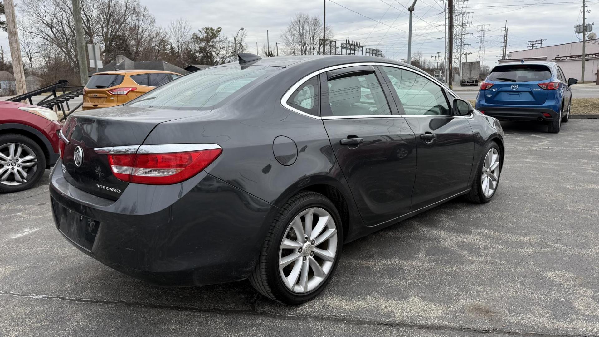 2015 DARK GRAY /TAN Buick Verano Base (1G4PP5SK4F4) with an 2.4L L4 DOHC 16V FFV engine, 6-Speed Automatic transmission, located at 2710A Westlane Rd., Indianapolis, IN, 46268, (317) 291-2000, 39.885670, -86.208160 - Photo#5