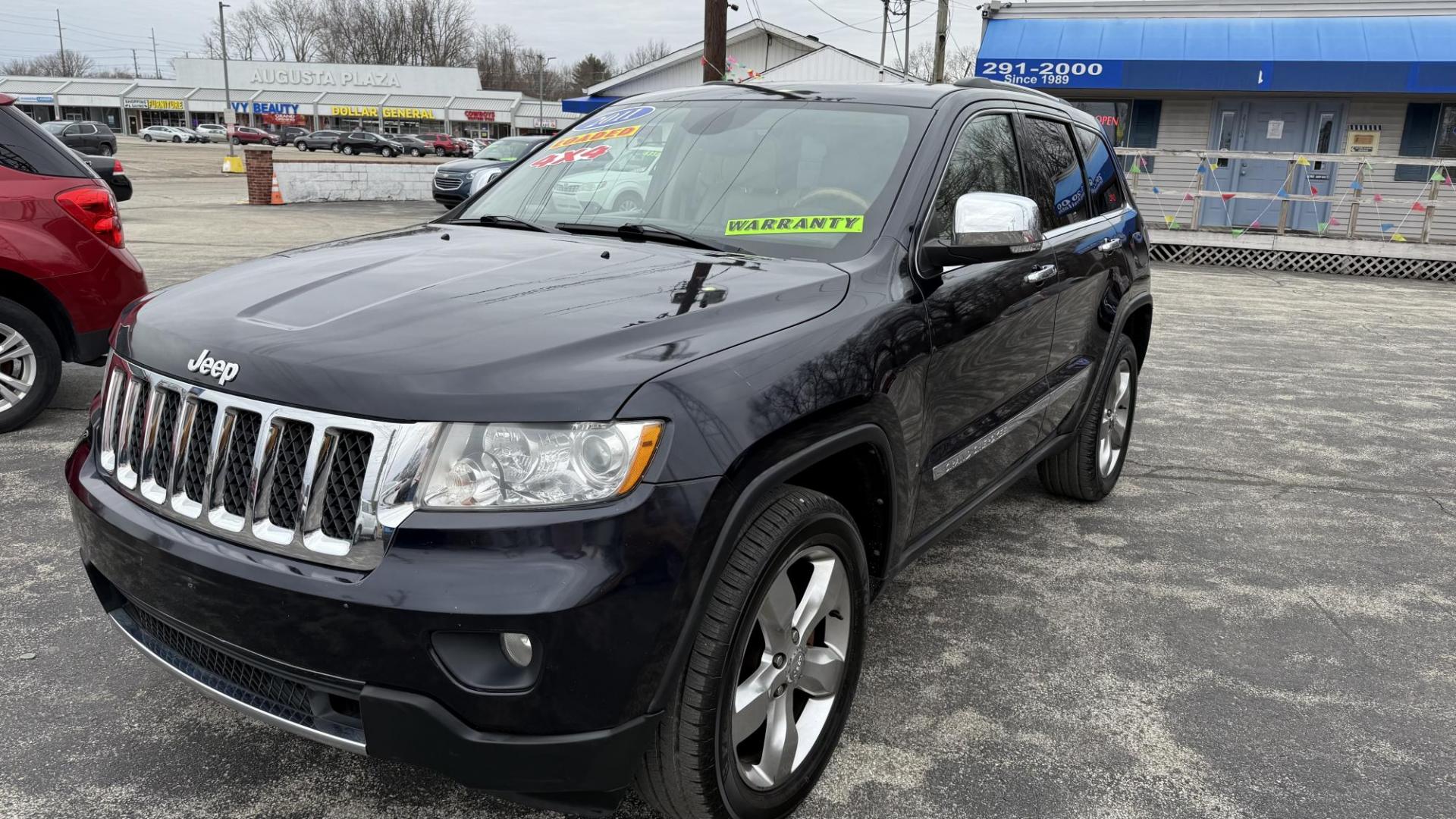 2011 DARK BLUE /BEIGE Jeep Grand Cherokee Overland 4WD (1J4RR6GG0BC) with an 3.6L V6 DOHC 24V engine, 5-Speed Automatic transmission, located at 2710A Westlane Rd., Indianapolis, IN, 46268, (317) 291-2000, 39.885670, -86.208160 - Photo#1