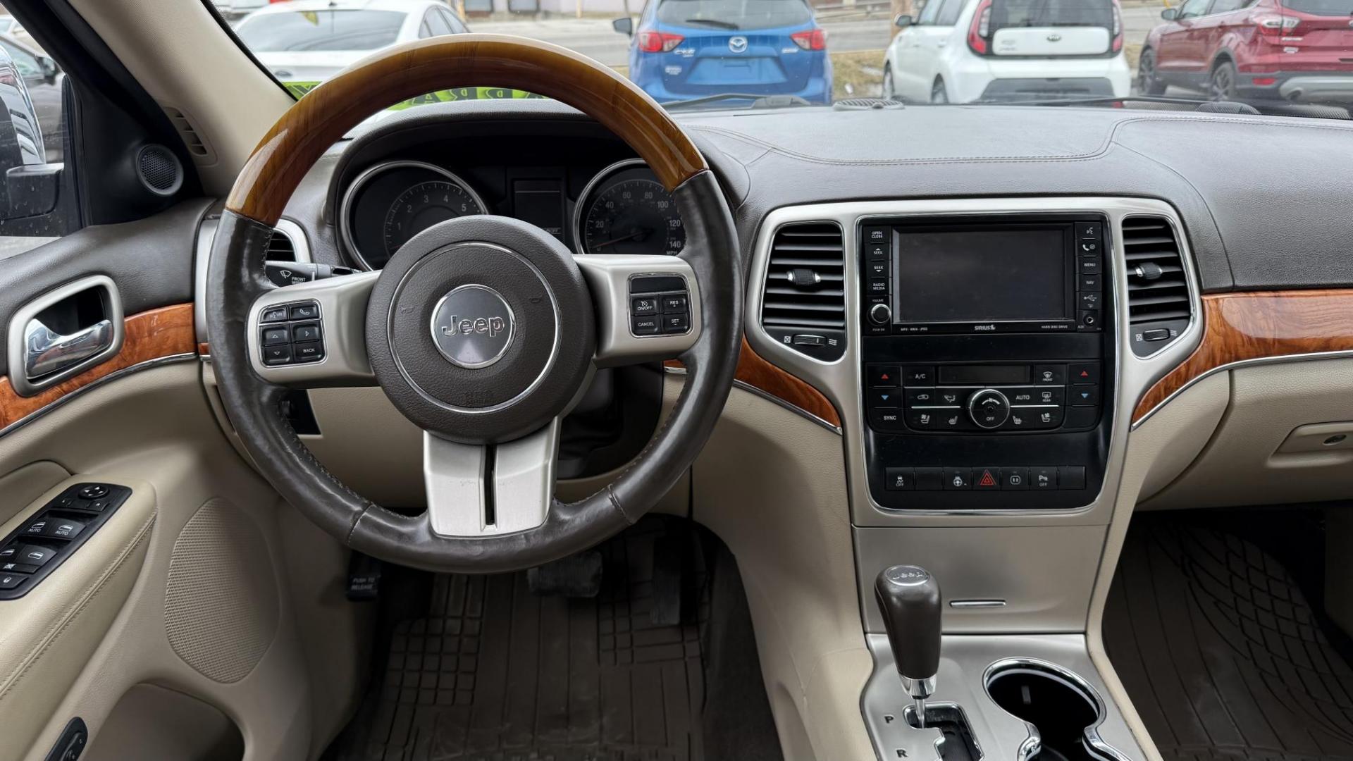 2011 DARK BLUE /BEIGE Jeep Grand Cherokee Overland 4WD (1J4RR6GG0BC) with an 3.6L V6 DOHC 24V engine, 5-Speed Automatic transmission, located at 2710A Westlane Rd., Indianapolis, IN, 46268, (317) 291-2000, 39.885670, -86.208160 - Photo#6