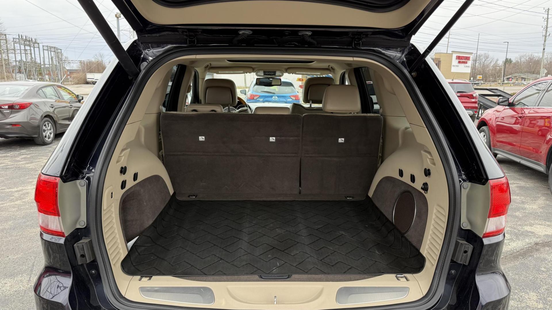 2011 DARK BLUE /BEIGE Jeep Grand Cherokee Overland 4WD (1J4RR6GG0BC) with an 3.6L V6 DOHC 24V engine, 5-Speed Automatic transmission, located at 2710A Westlane Rd., Indianapolis, IN, 46268, (317) 291-2000, 39.885670, -86.208160 - Photo#7
