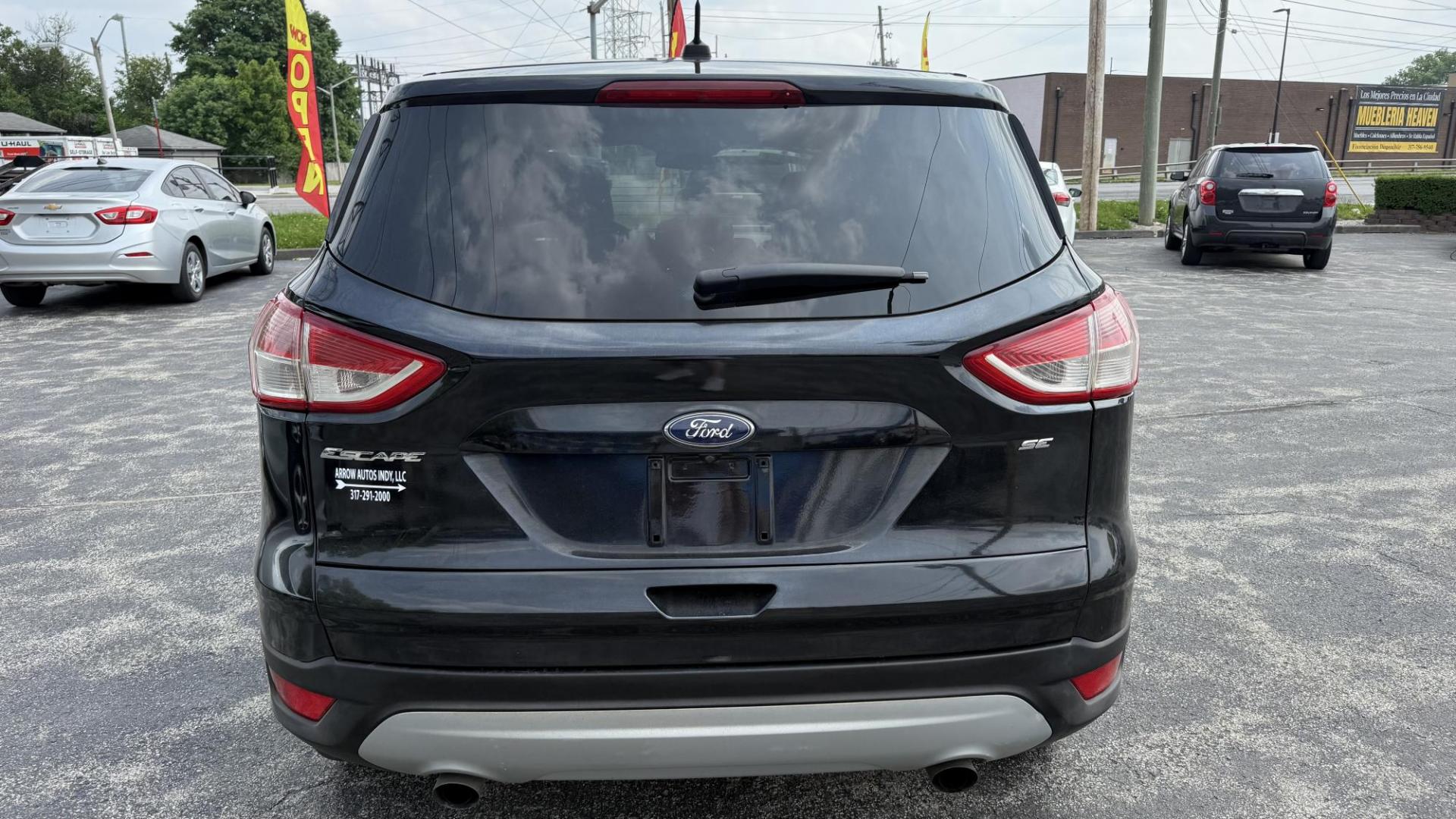 2016 BLACK /GRAY Ford Escape SE FWD (1FMCU0G76GU) with an 2.5L L4 DOHC 16V engine, 6-Speed Automatic transmission, located at 2710A Westlane Rd., Indianapolis, IN, 46268, (317) 291-2000, 39.885670, -86.208160 - Photo#4