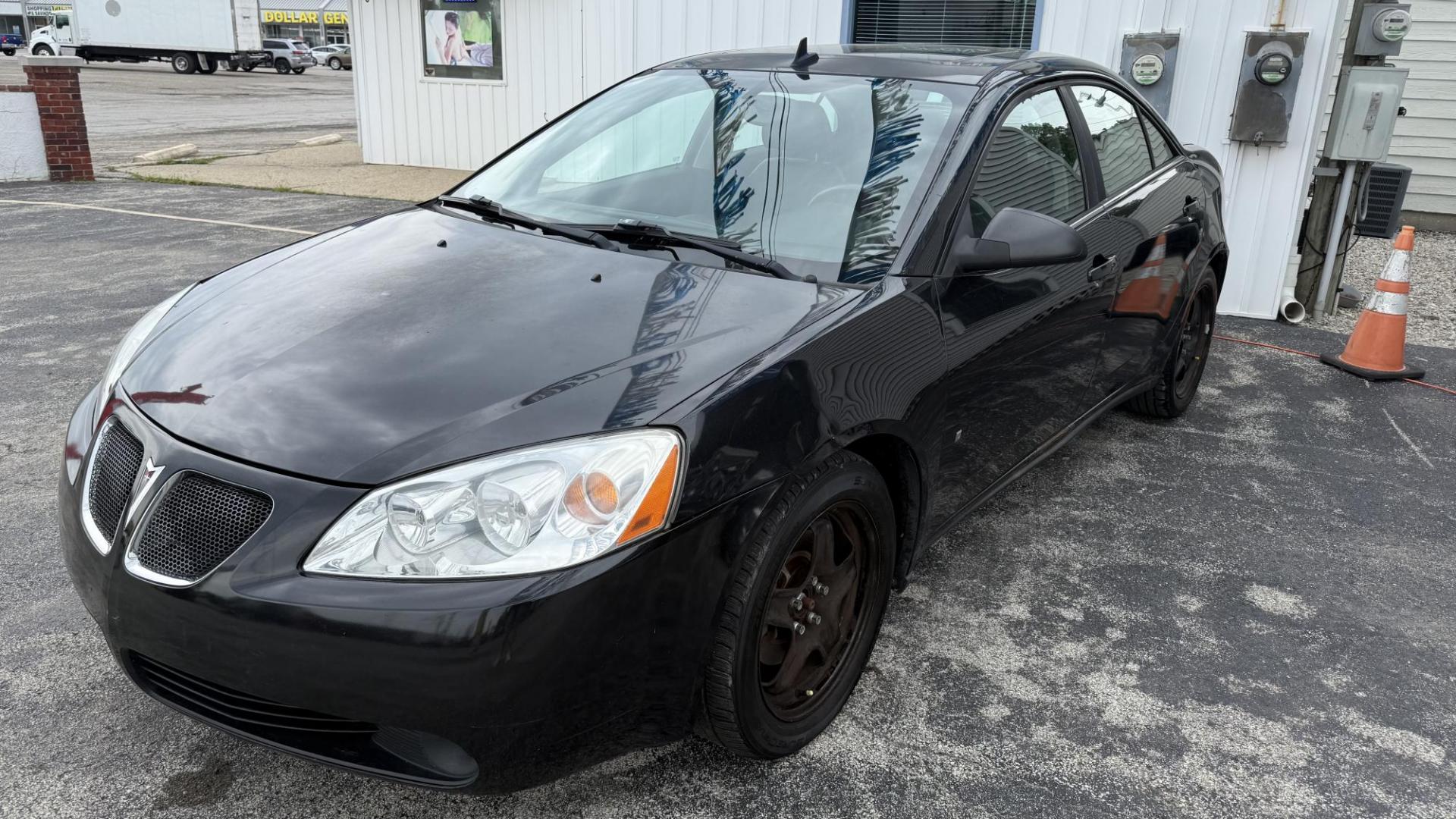 2009 BLACK /BLACK Pontiac G6 Sedan (1G2ZG57BX94) with an 2.4L L4 DOHC 16V engine, 4-Speed Automatic Overdrive transmission, located at 2710A Westlane Rd., Indianapolis, IN, 46268, (317) 291-2000, 39.885670, -86.208160 - Photo#0