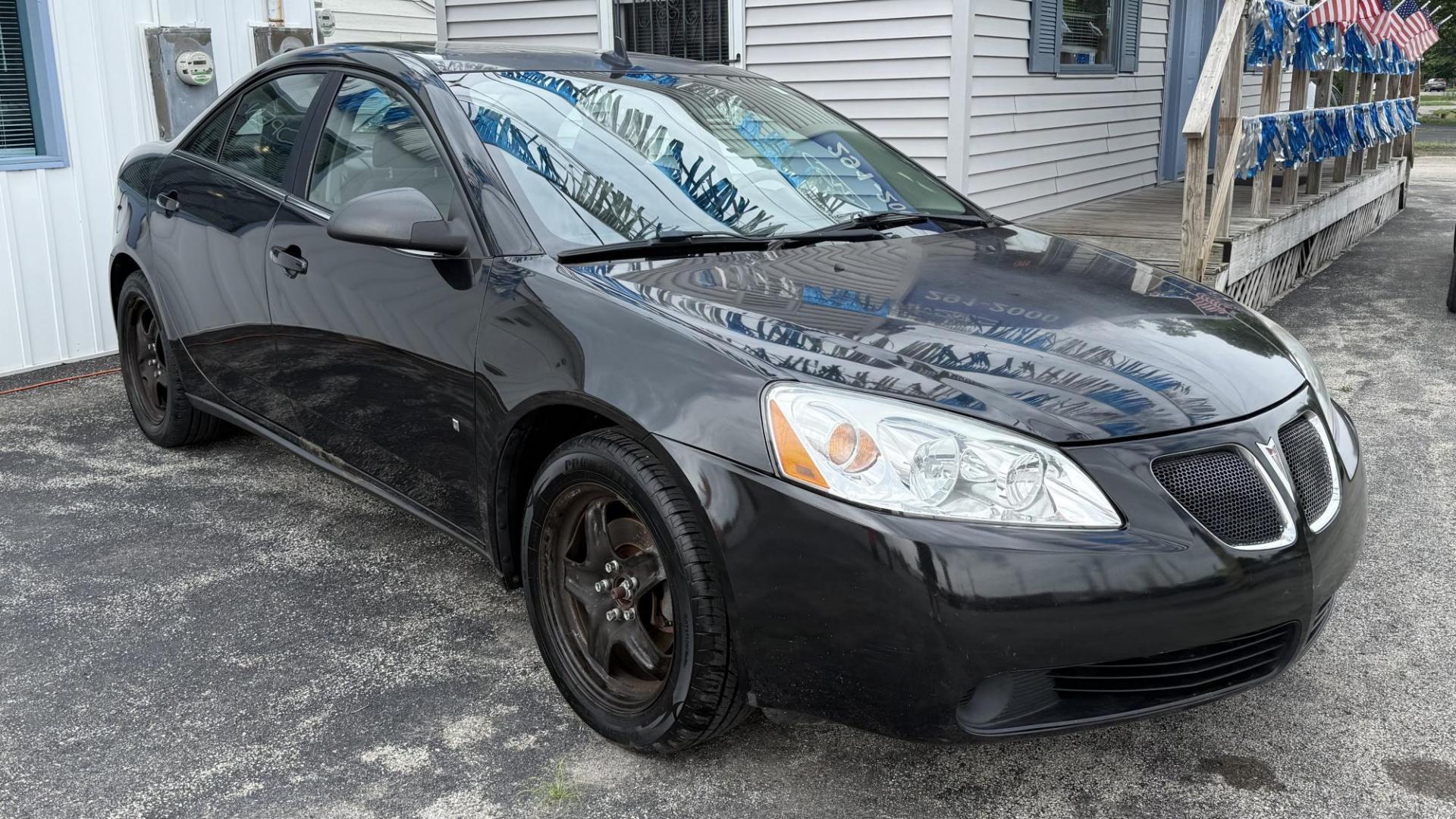 2009 BLACK /BLACK Pontiac G6 Sedan (1G2ZG57BX94) with an 2.4L L4 DOHC 16V engine, 4-Speed Automatic Overdrive transmission, located at 2710A Westlane Rd., Indianapolis, IN, 46268, (317) 291-2000, 39.885670, -86.208160 - Photo#1