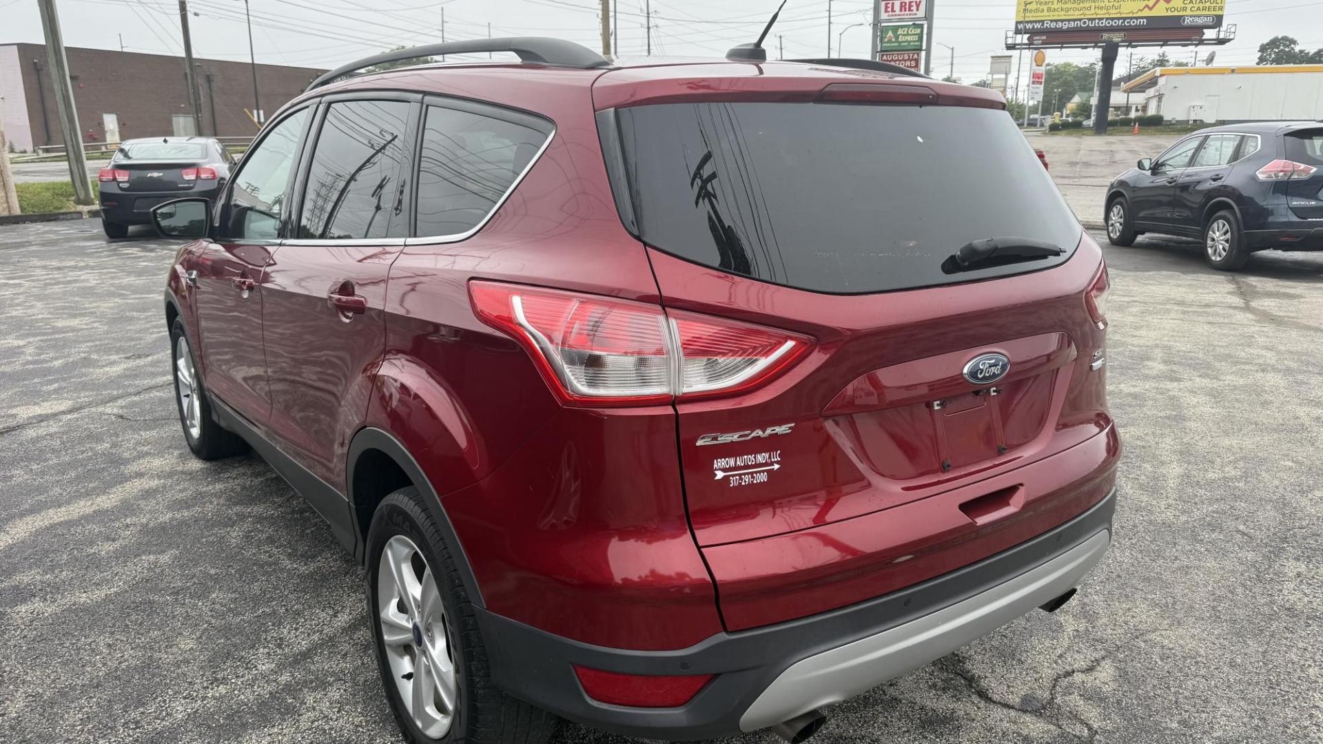 2015 RED /TAN Ford Escape SE 4WD (1FMCU9GX1FU) with an 1.6L L4 DOHC 16V engine, 6-Speed Automatic transmission, located at 2710A Westlane Rd., Indianapolis, IN, 46268, (317) 291-2000, 39.885670, -86.208160 - Photo#7