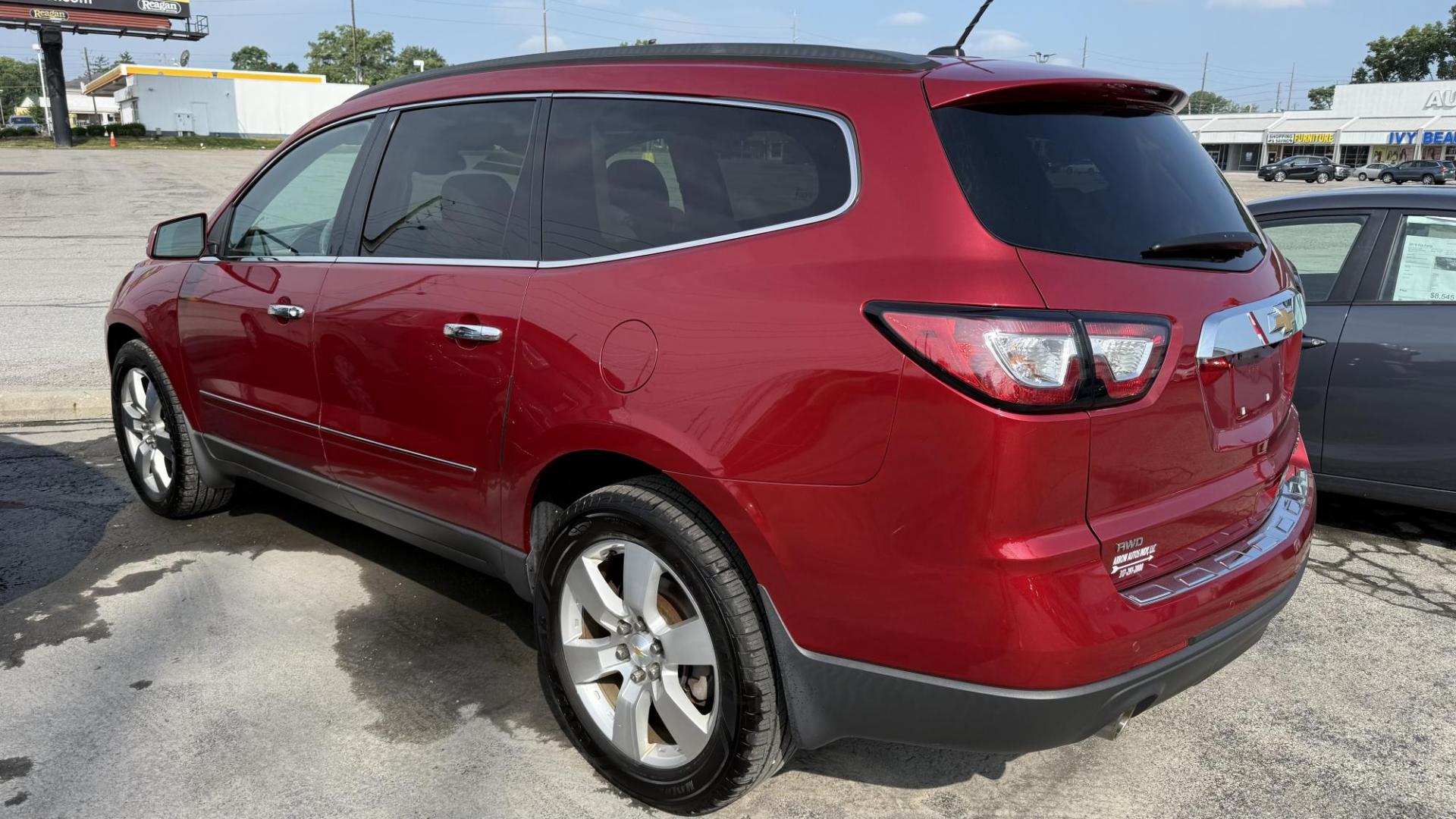 2014 RED /TAN Chevrolet Traverse LTZ AWD (1GNKVJKD1EJ) with an 3.6L V6 DOHC 24V engine, 6-Speed Automatic transmission, located at 2710A Westlane Rd., Indianapolis, IN, 46268, (317) 291-2000, 39.885670, -86.208160 - Photo#5