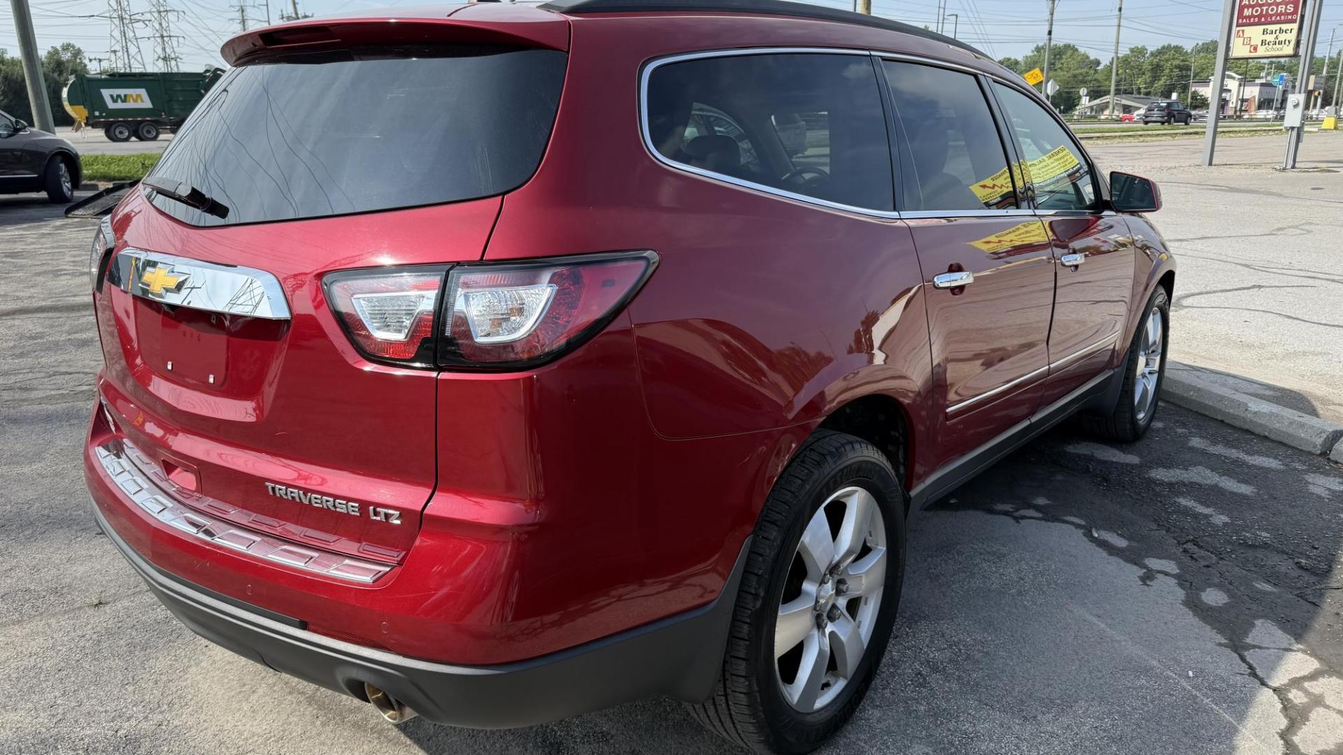 2014 RED /TAN Chevrolet Traverse LTZ AWD (1GNKVJKD1EJ) with an 3.6L V6 DOHC 24V engine, 6-Speed Automatic transmission, located at 2710A Westlane Rd., Indianapolis, IN, 46268, (317) 291-2000, 39.885670, -86.208160 - Photo#7