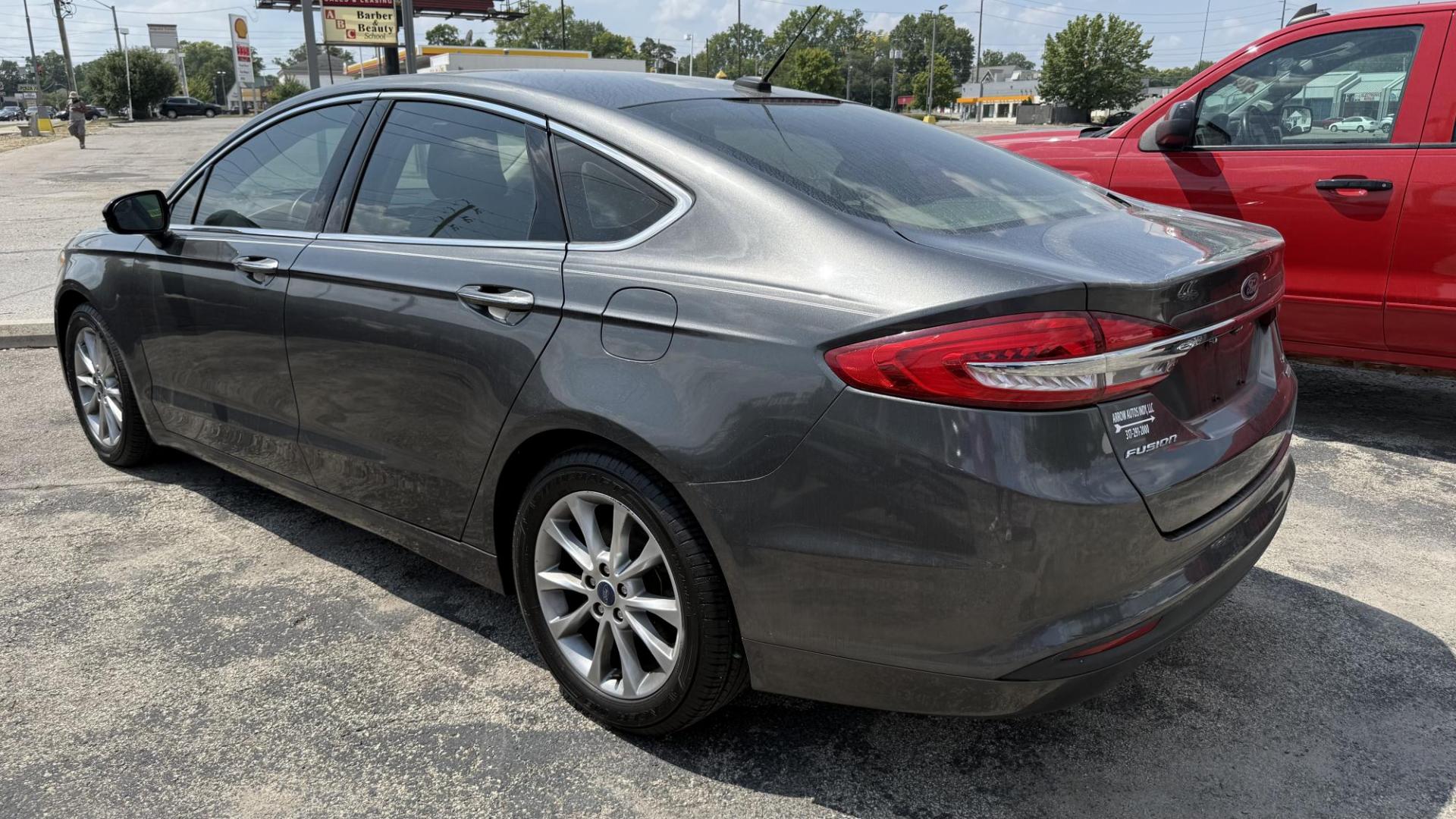 2017 GRAY /TAN Ford Fusion SE (3FA6P0HD8HR) with an 1.5L L4 DOHC 16V engine, 6A transmission, located at 2710A Westlane Rd., Indianapolis, IN, 46268, (317) 291-2000, 39.885670, -86.208160 - Photo#4