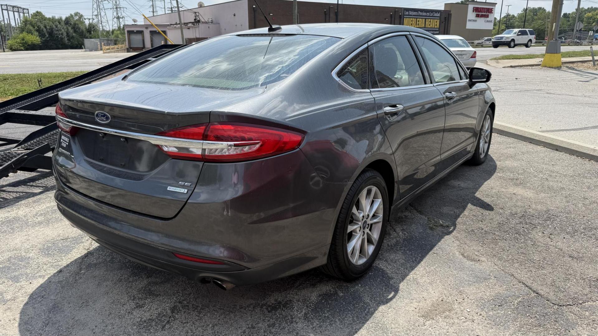 2017 GRAY /TAN Ford Fusion SE (3FA6P0HD8HR) with an 1.5L L4 DOHC 16V engine, 6A transmission, located at 2710A Westlane Rd., Indianapolis, IN, 46268, (317) 291-2000, 39.885670, -86.208160 - Photo#5