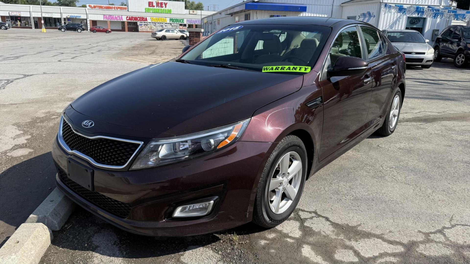 2015 MAROON /BEIGE Kia Optima LX (5XXGM4A71FG) with an 2.4L L4 DOHC 16V engine, 6-Speed Automatic transmission, located at 2710A Westlane Rd., Indianapolis, IN, 46268, (317) 291-2000, 39.885670, -86.208160 - Photo#1