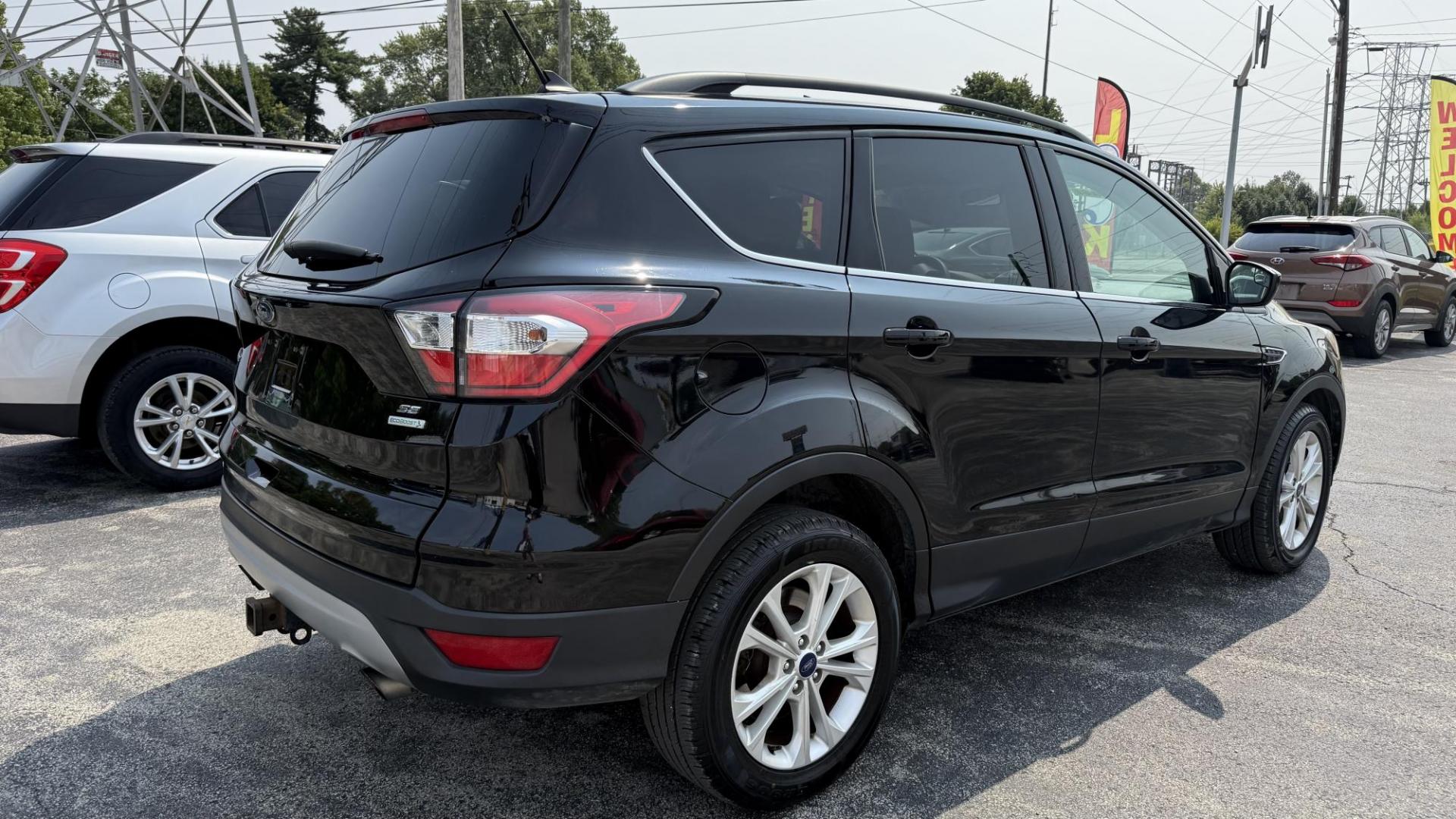 2018 BLACK /TAN Ford Escape SE FWD (1FMCU0GD8JU) with an 1.5L L4 DOHC 16V engine, 6A transmission, located at 2710A Westlane Rd., Indianapolis, IN, 46268, (317) 291-2000, 39.885670, -86.208160 - Photo#4