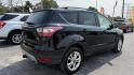 2018 BLACK /TAN Ford Escape SE FWD (1FMCU0GD8JU) with an 1.5L L4 DOHC 16V engine, 6A transmission, located at 2710A Westlane Rd., Indianapolis, IN, 46268, (317) 291-2000, 39.885670, -86.208160 - Photo#4