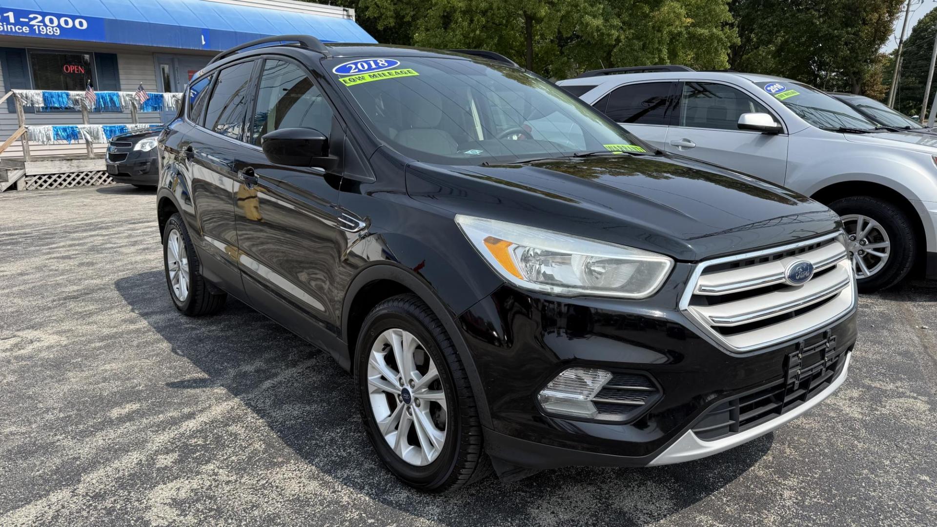 2018 BLACK /TAN Ford Escape SE FWD (1FMCU0GD8JU) with an 1.5L L4 DOHC 16V engine, 6A transmission, located at 2710A Westlane Rd., Indianapolis, IN, 46268, (317) 291-2000, 39.885670, -86.208160 - Photo#0
