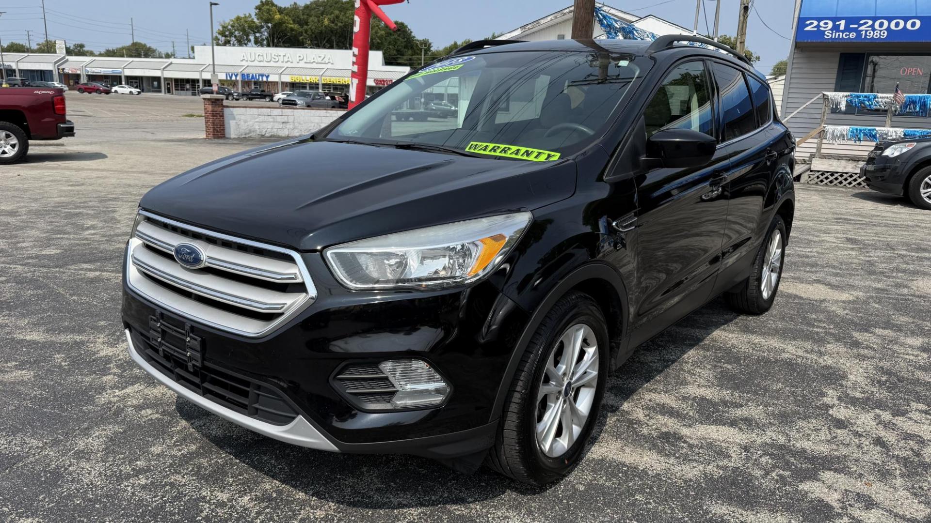 2018 BLACK /TAN Ford Escape SE FWD (1FMCU0GD8JU) with an 1.5L L4 DOHC 16V engine, 6A transmission, located at 2710A Westlane Rd., Indianapolis, IN, 46268, (317) 291-2000, 39.885670, -86.208160 - Photo#1